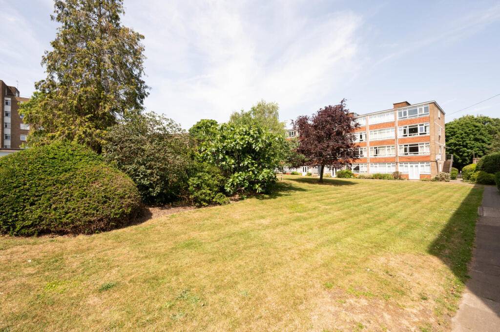 Spacious Three-Bedroom Apartment with Private Garage & Communal Gardens