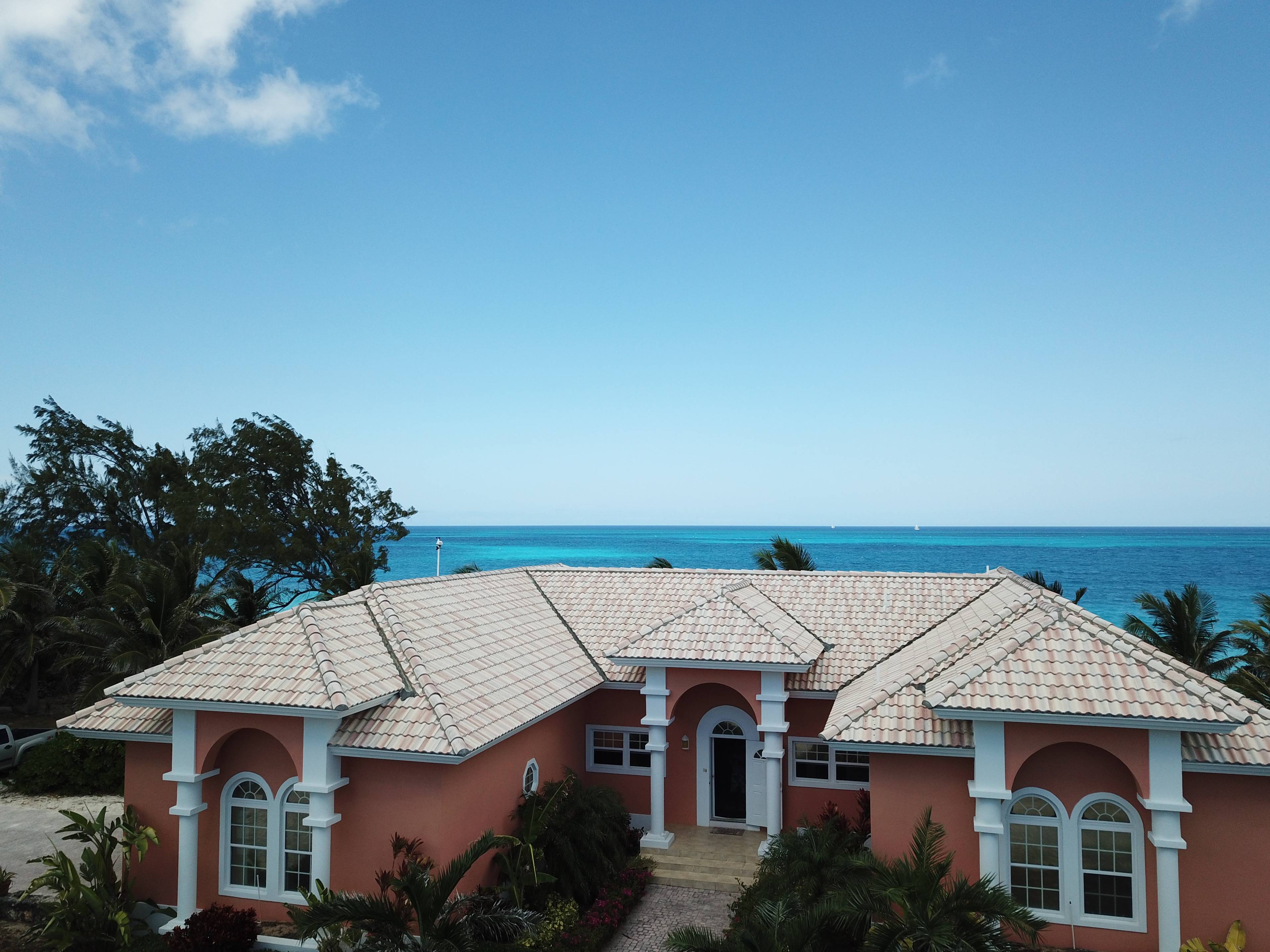 CARIBBEAN BEACHFRONT OASIS 2-ACRE OCEANFRONT LAND + HOME IN EXUMA, BAHAMAS