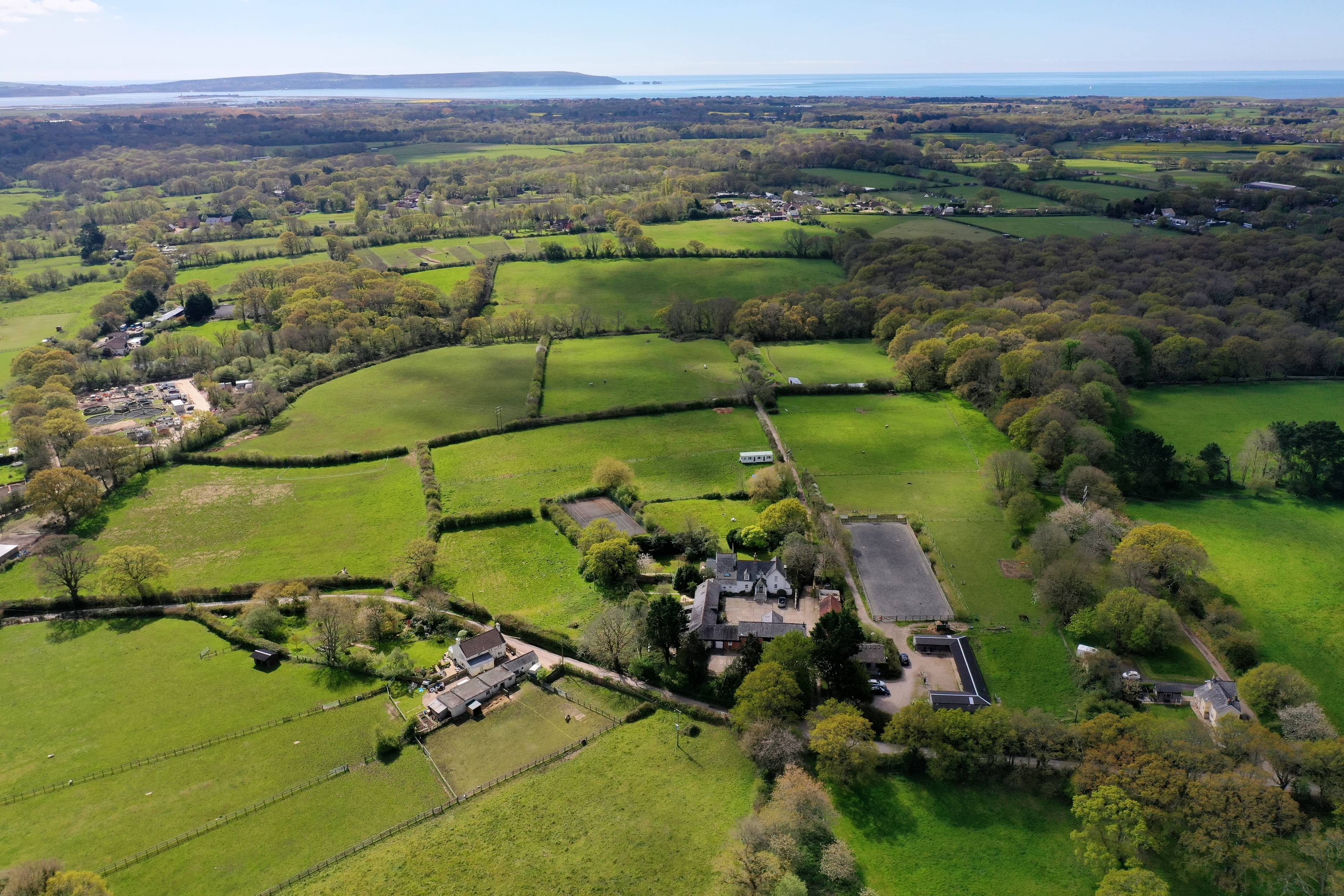 A very special and most versatile residential and equestrian New Forest estate with circa 9 acres of land with stabling, full size dressage arena and holiday letting business.