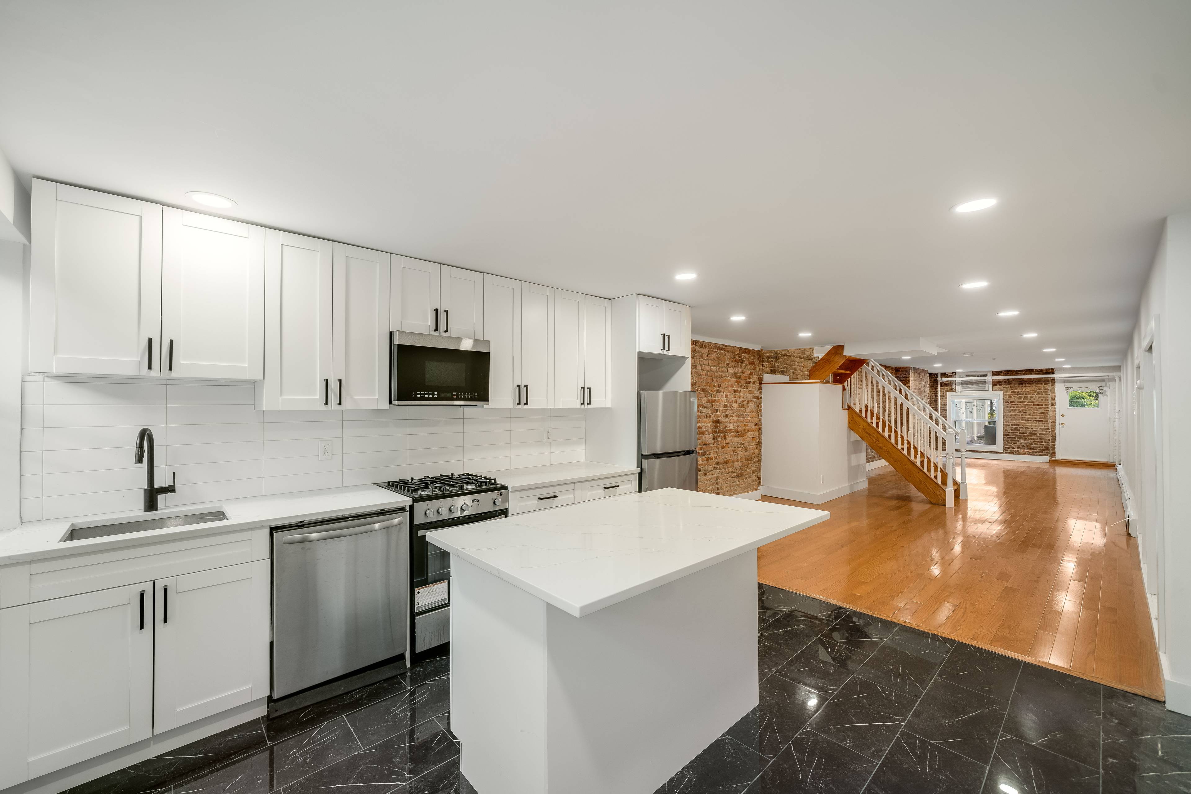 Rarely Available Renovated 1 Bedroom Duplex Home with Private Backyard!   Moments to Path Station & Bus Stop!  Pets Welcome!  Private Backyard!