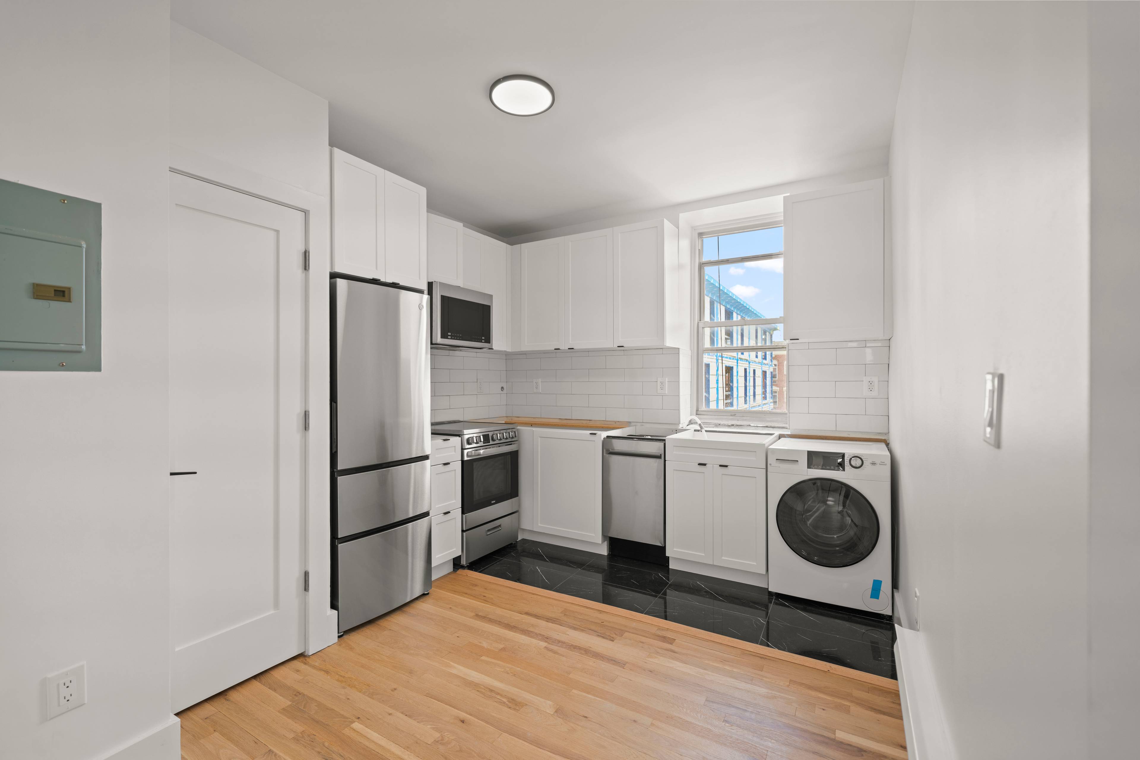 Renovated 3 Bedroom apartment located in Uptown Hoboken NJ.  Laundry In Unit!  Across from Trader Joes!  No Fee and 1 Month Free!