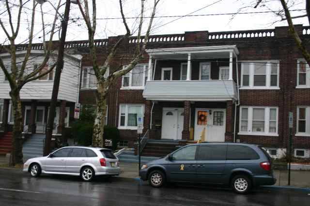 LOVELY BRICK TWO FAMILY ROW HOME UPTOWN LOCATION.