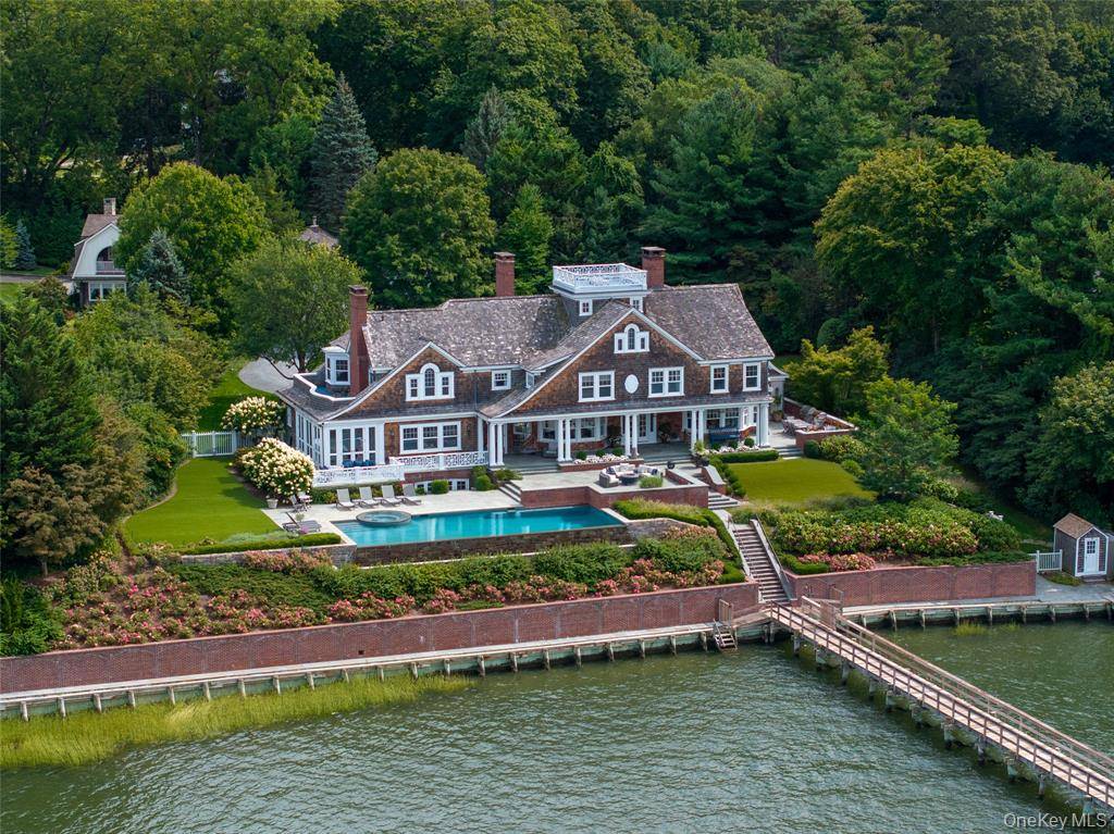 Direct Waterfront Estate with 300+ Ft Deep-Water Dock in Cove Neck