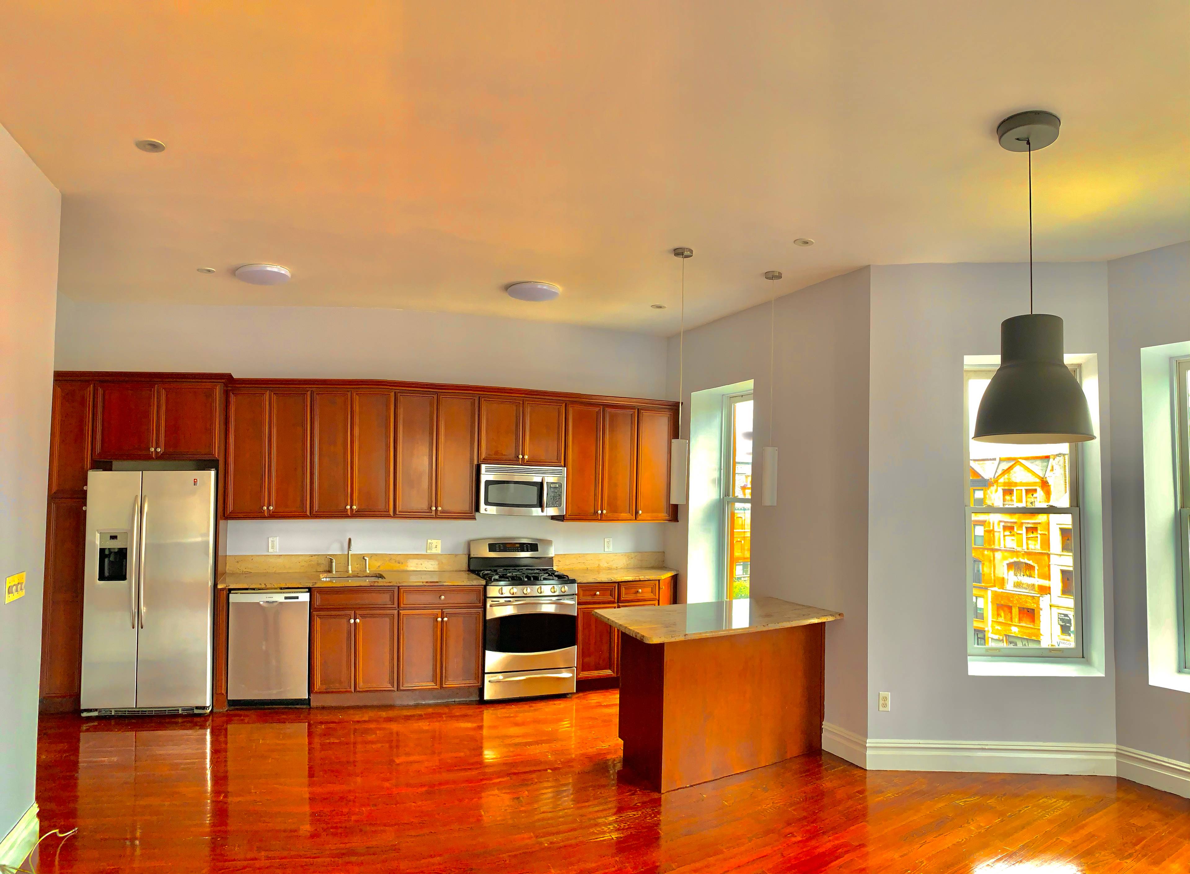 Spectacular full floor-through,corner South, East and West facing apartment in a beautiful 25 foot wide brownstone