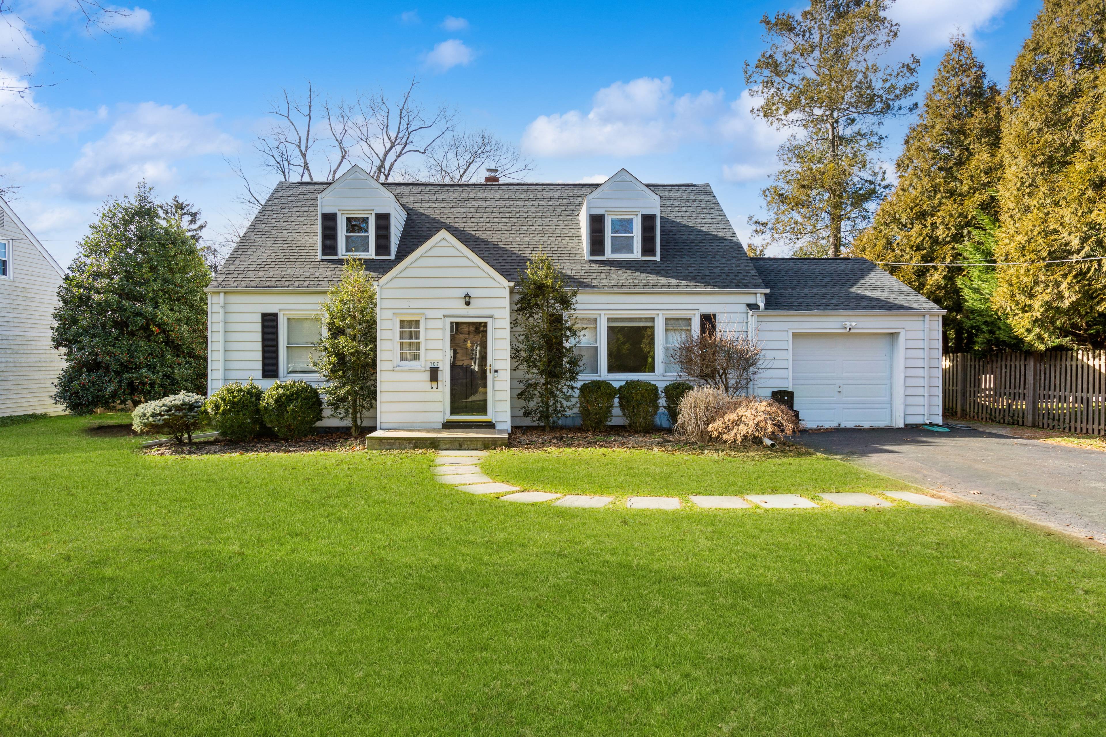 Exquisite Cape Cod Home with Stunning Backyard Oasis