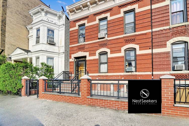 Love the vibe of this three-family townhome perfectly positioned on the LIC/Astoria border.