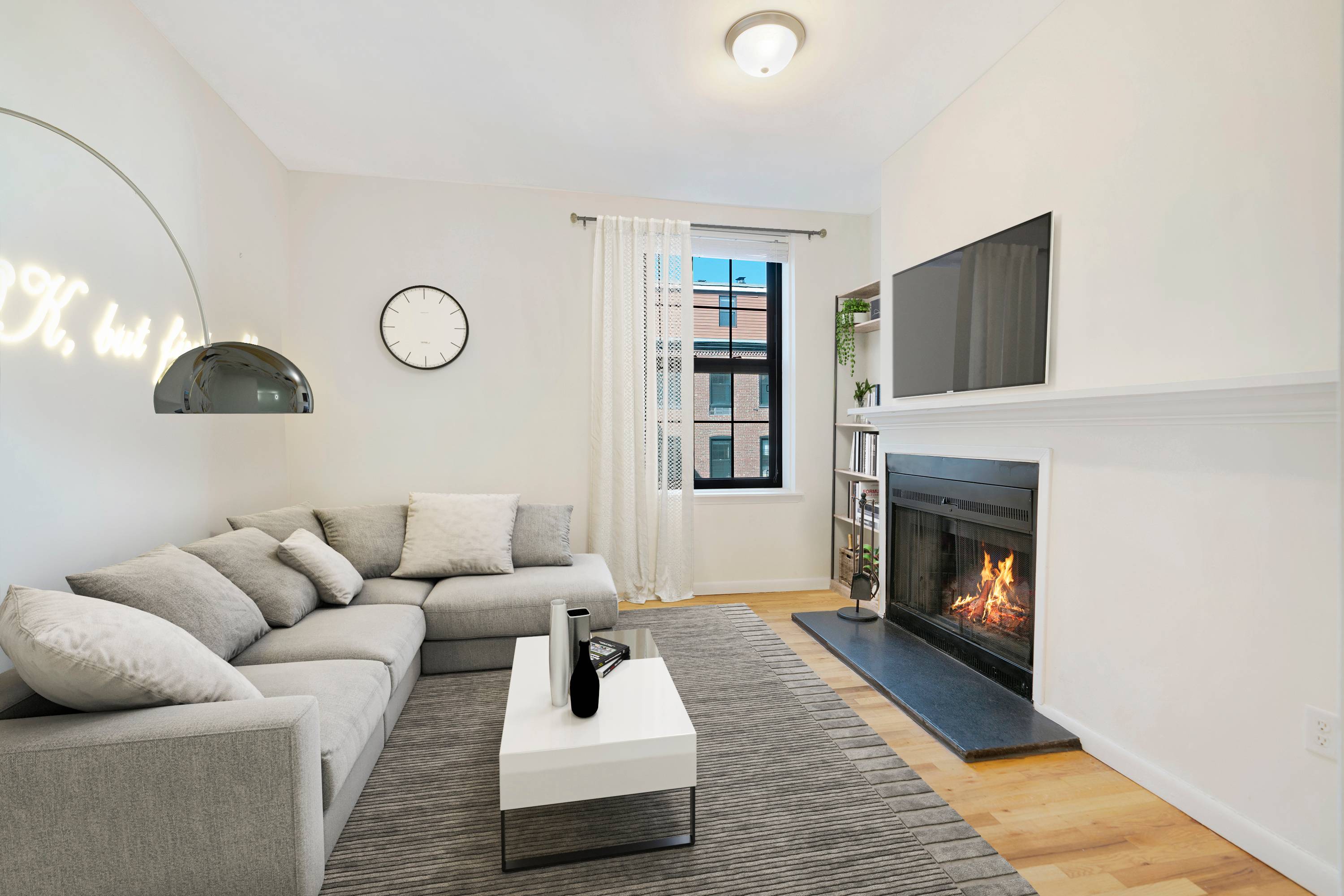 Beautiful Open and Spacious 2 Bedroom 1.5 Bathroom with Roofdeck and Wood Burning Fireplace located at the Grand Adams in Downtown Hoboken!