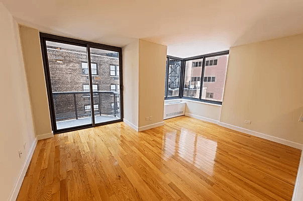 Midtown Manhattan Corner One Bedroom Apartment with Private Balcony and Modern Amenities!