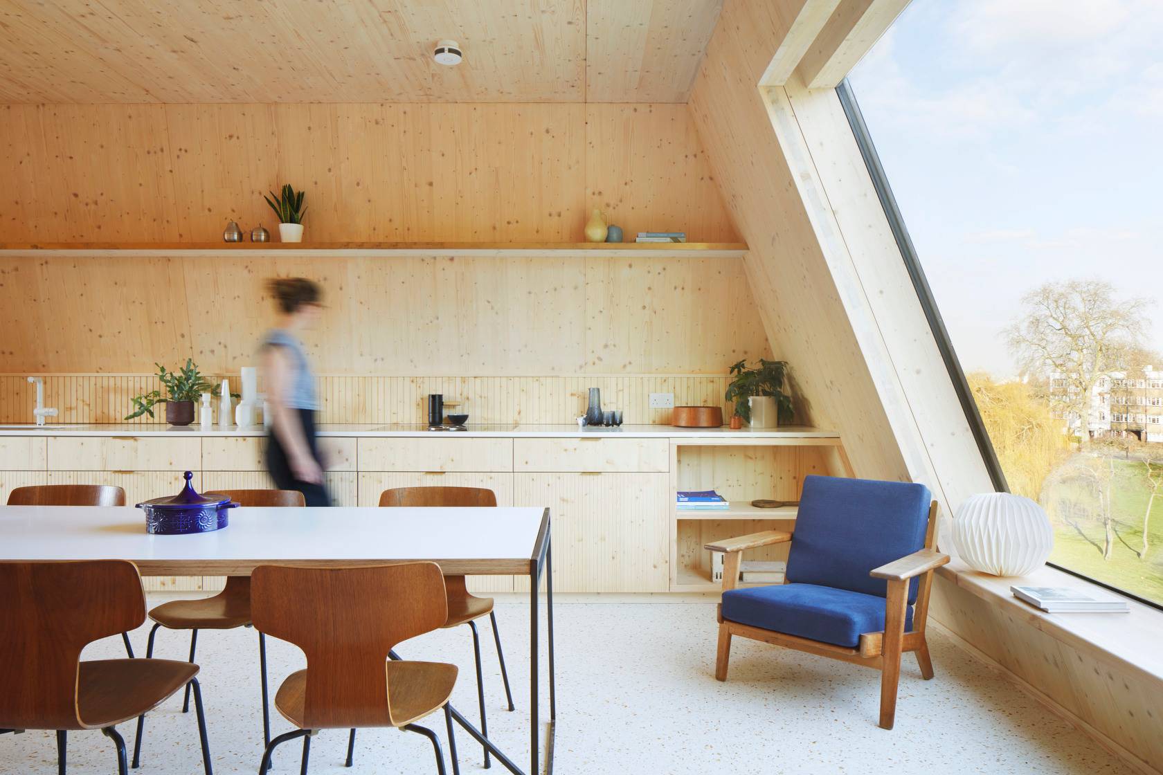 Three-bedroom triple aspect apartment with modern minimalistic ‘Scandi’ design that brings clean stylish look and provides cool space to live in featuring pretty views of Peckham Rye Park.
