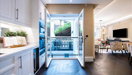 An exceptional three-bedroom, 1,412 sqft apartment arranged across the Ground Floor and Courtyard levels of the building.