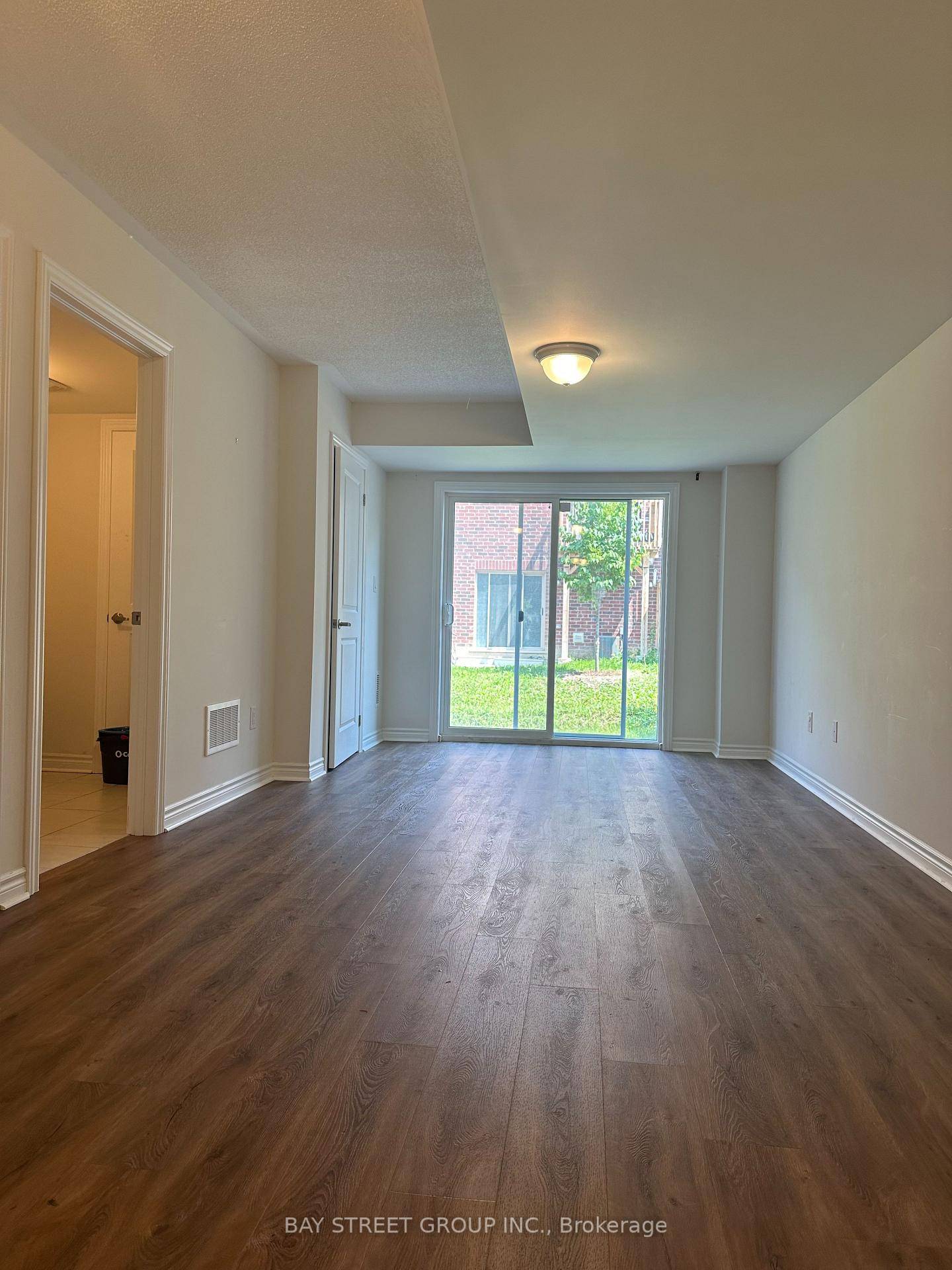 Stunning Townhome With Walk Out Ground Level Family Room In Most Sought After College Manor.