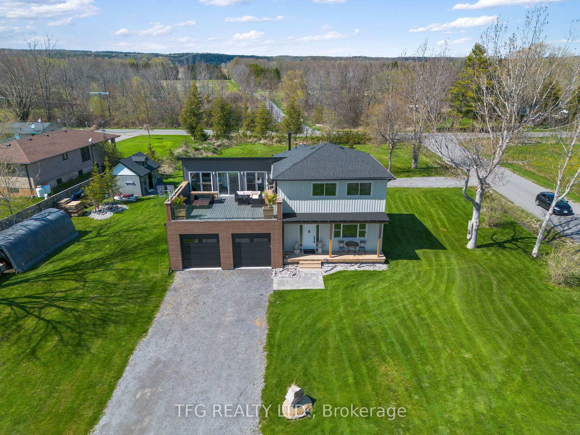 Newly renovated 2022 2024 custom home on over half an acre offers modern lakeside living with small town vibes.