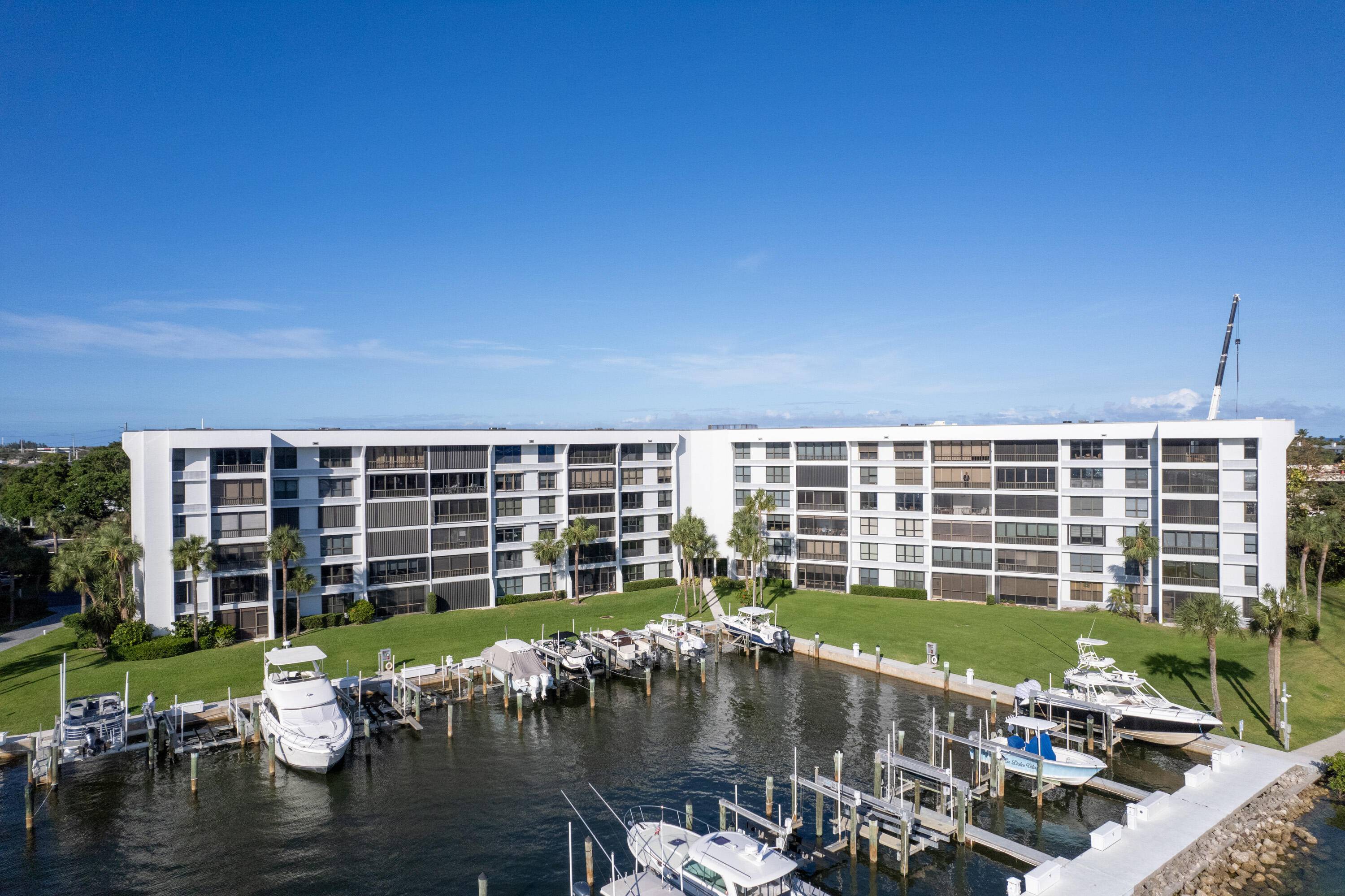 Stunning water views from this top floor impeccably renovated 2 2 condominium in the highly desirable direct Intracoastal gated community of Jupiter Cove.