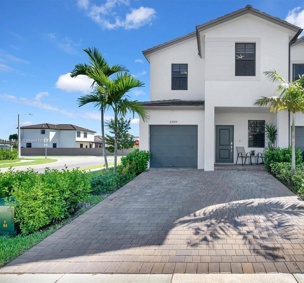 Rare end unit 2 story townhome with garage in Southwest Miami showcasing high end upgrades throughout.