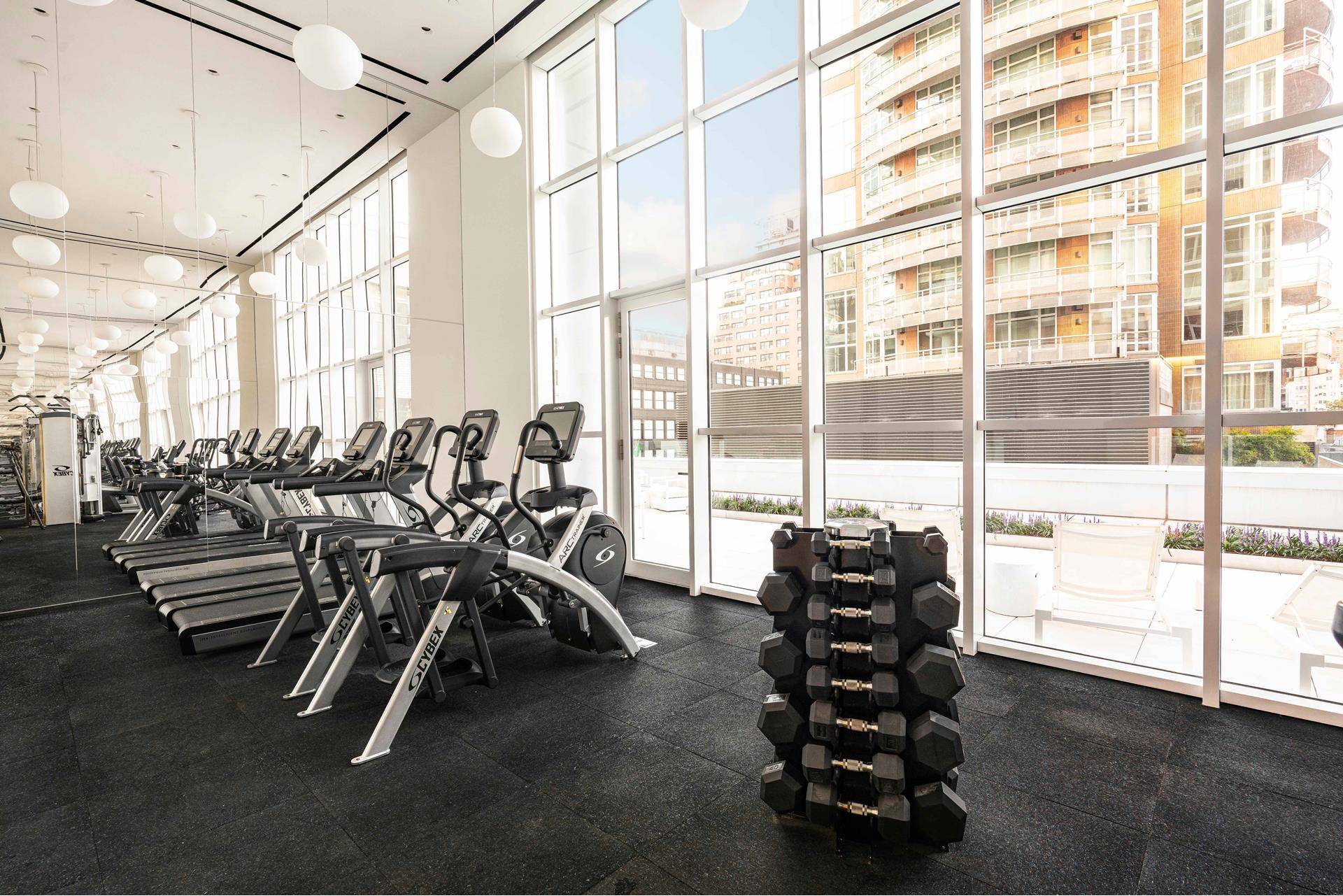 This spacious, corner 1, 416 square foot two bedroom, two and a half bath residence features a deep wraparound terrace overlooking Central Park, and western views of the Midtown skyline.