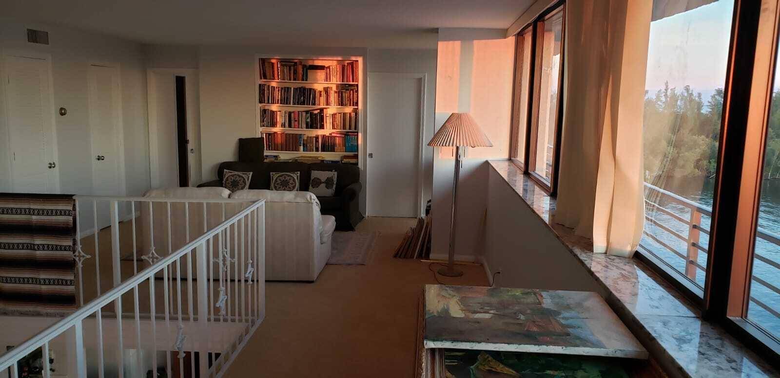 This multi level penthouse boasts a unique two story layout with 16' ceilings and a wrap around balcony.