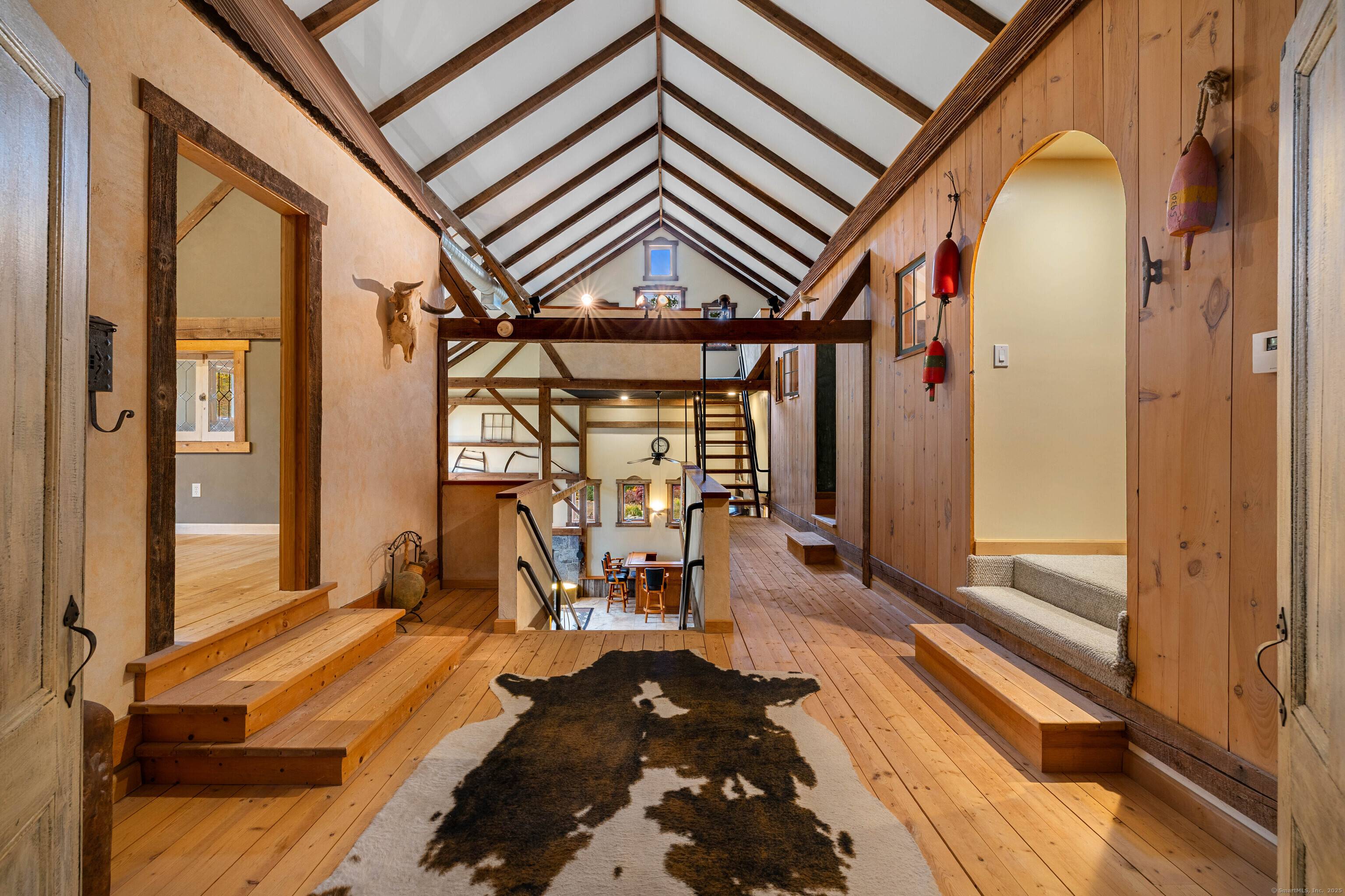 Secluded on 6 acres surrounded by a Wildlife Refuge, this post and beam barn preserved from Northern CT was designed by various architects and interior designers to create an infusion ...