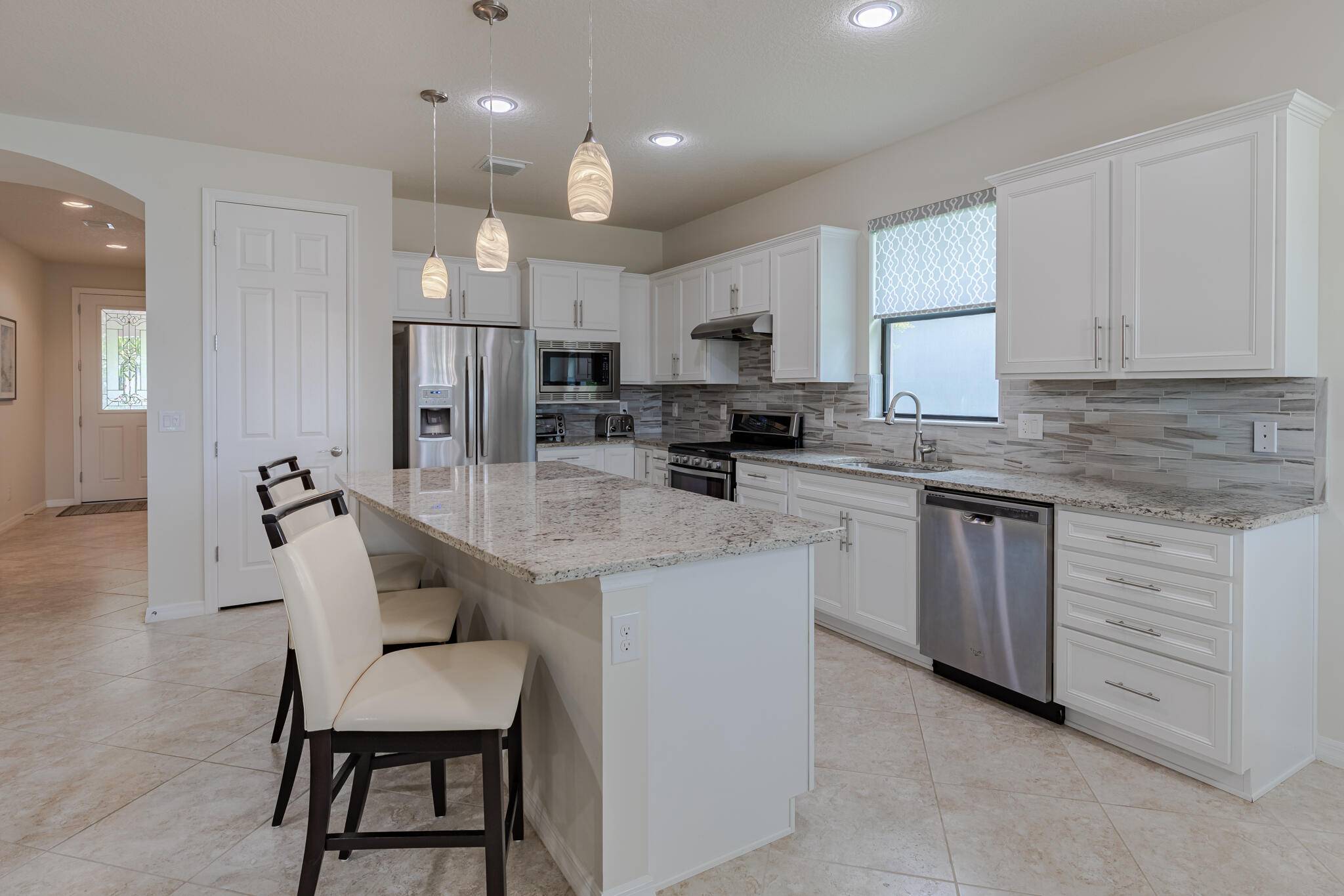 Welcome to this meticulously maintained home offering 2 bedrooms, 2 bathrooms, plus a versatile den office with French doors.