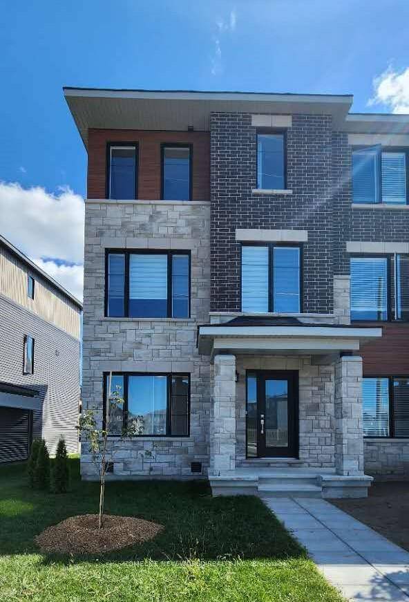 A brand new, never lived in end unit townhome with 2 parking garages in the highly desirable Kanata Lakes Arcadia community !