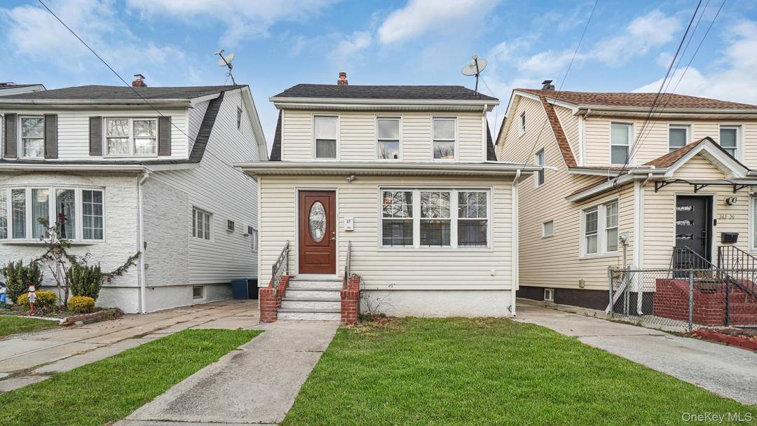 Beautifully updated and well maintained colonial in the heart of Bellerose featuring 5 spacious bedrooms and 3.