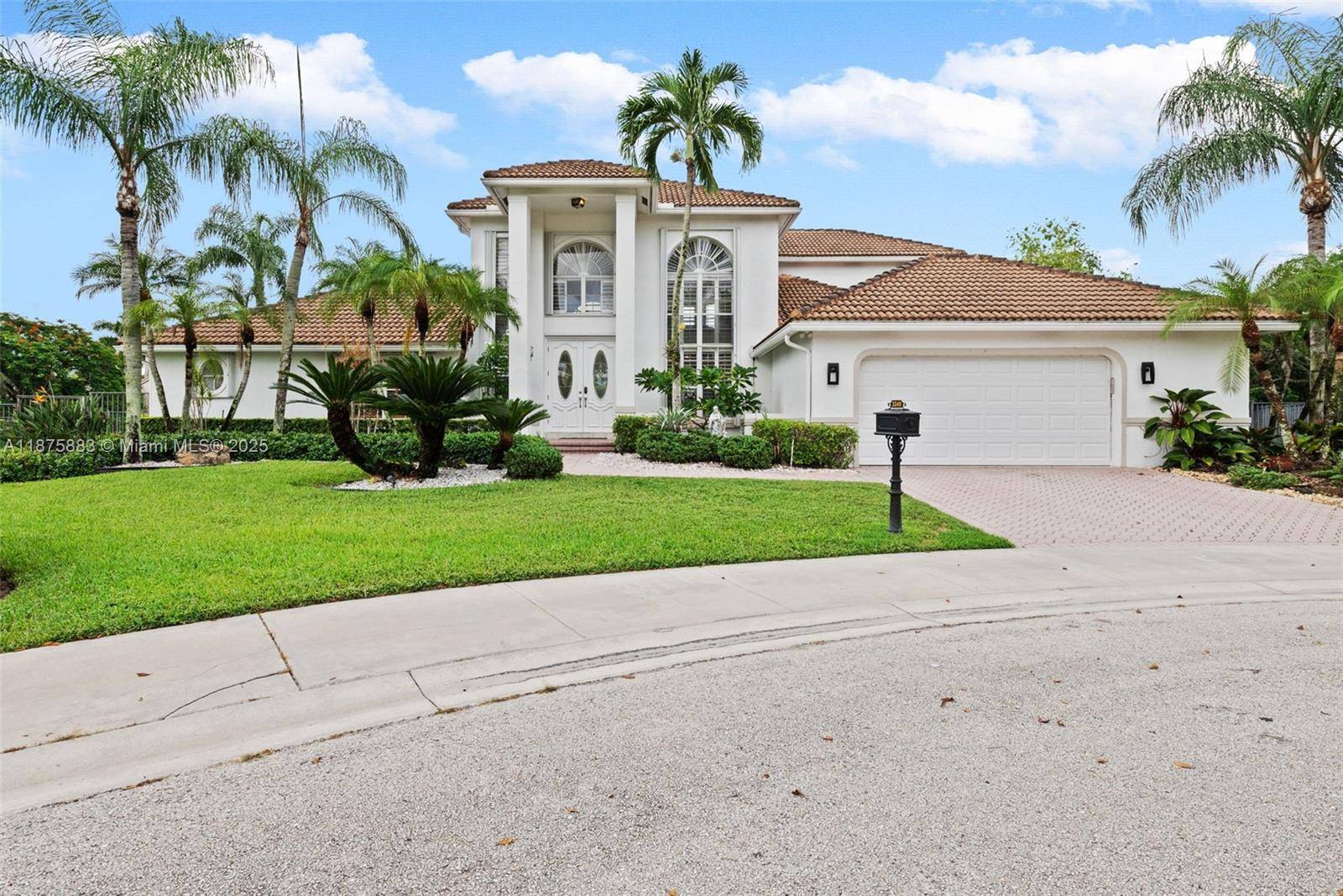 Welcome to this luxurious home featuring soaring ceilings, plantation shutters, French doors, modern stair railing, and accordion shutters.