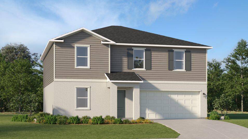 The first floor of this two story home shares an open layout between the kitchen, dining area and family room for easy entertaining with access to the patio.