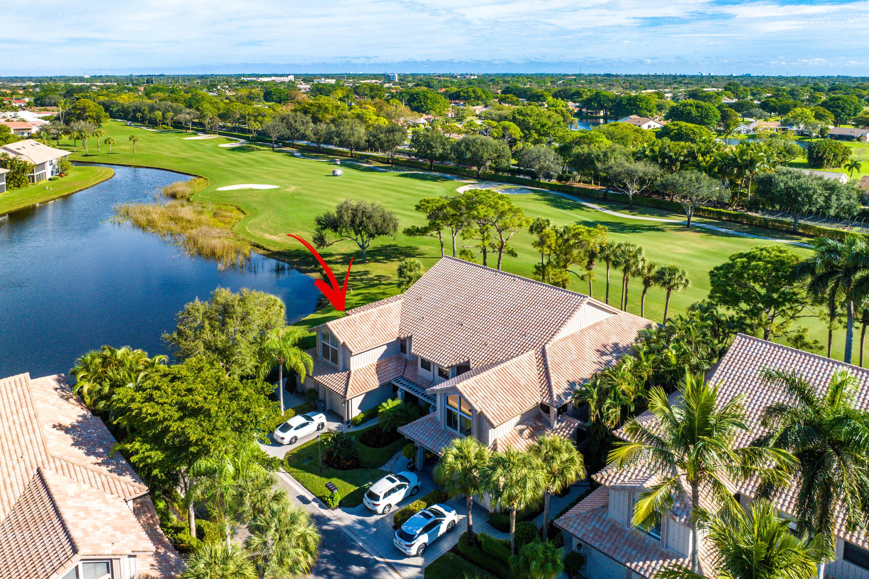 This spacious condo offers unparalleled panoramic views of the serene lake and sprawling golf course views.