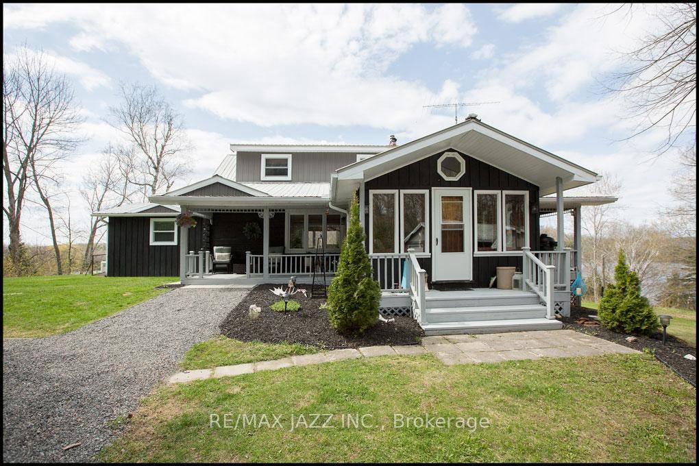 One of a kind three bedroom custom loft bungalow with walkout basement featuring classic stone work, pine beams combined with the latest in designer finishes all in this stunning open ...
