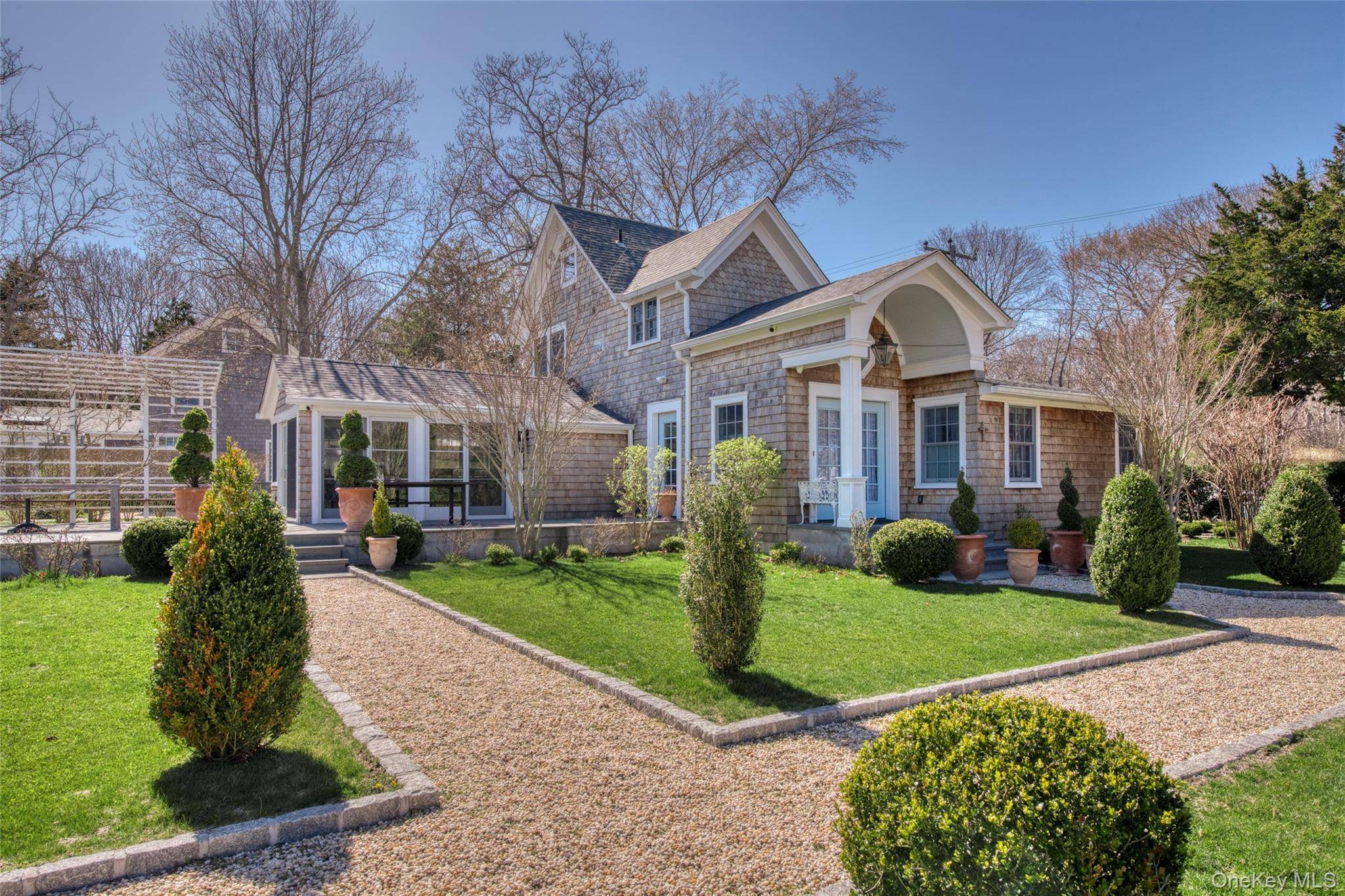 Immaculate French Country Farmhouse with heated, saltwater pool.