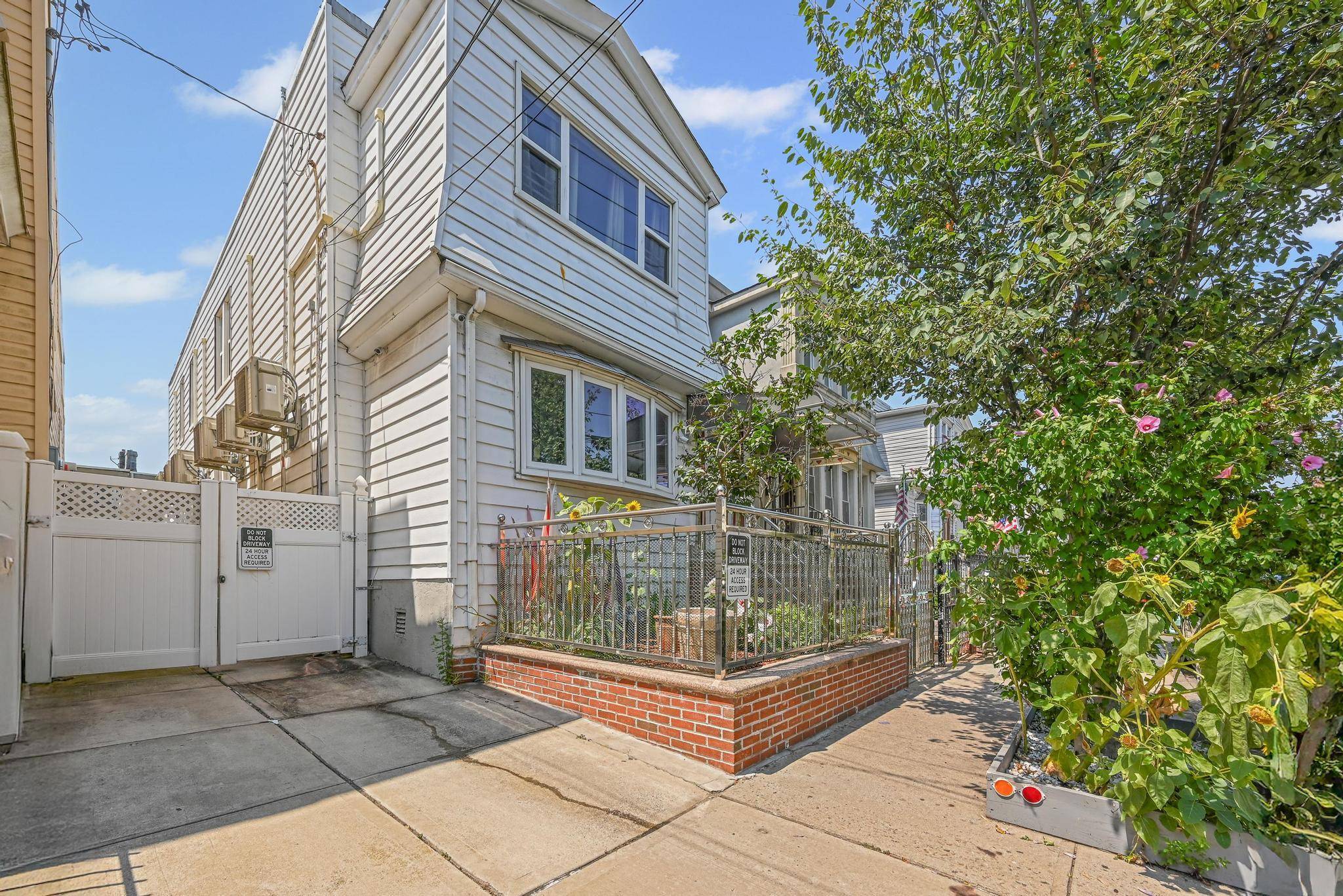 Welcome to this well maintained semi attached two family residence on a charming tree lined street in desirable Cityline Brooklyn, perfectly positioned at the Brooklyn Queens border.