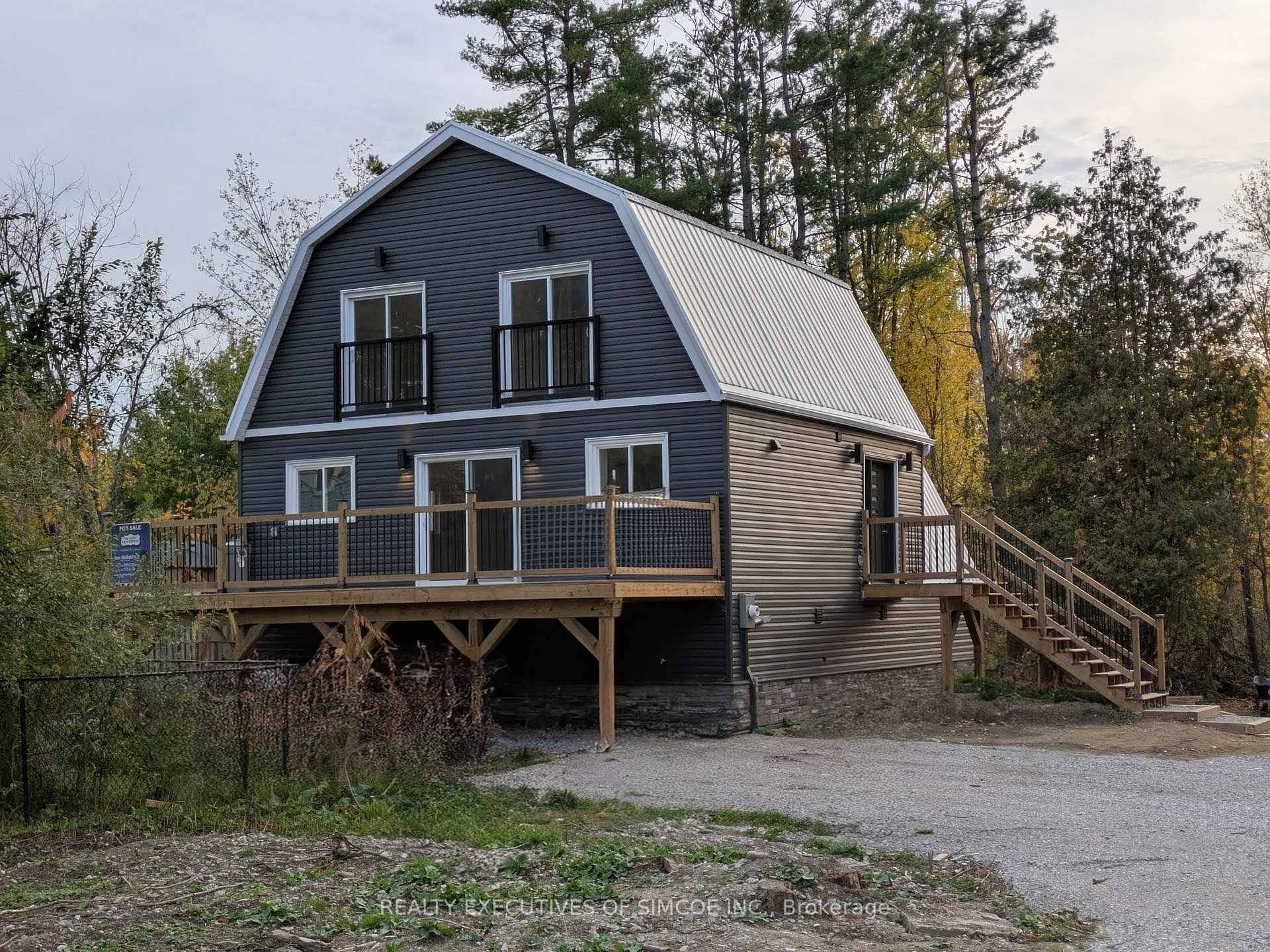 Nestled in the peaceful community of Cumberland Beach, Severn Township, this home is where modern living meets natural beauty.