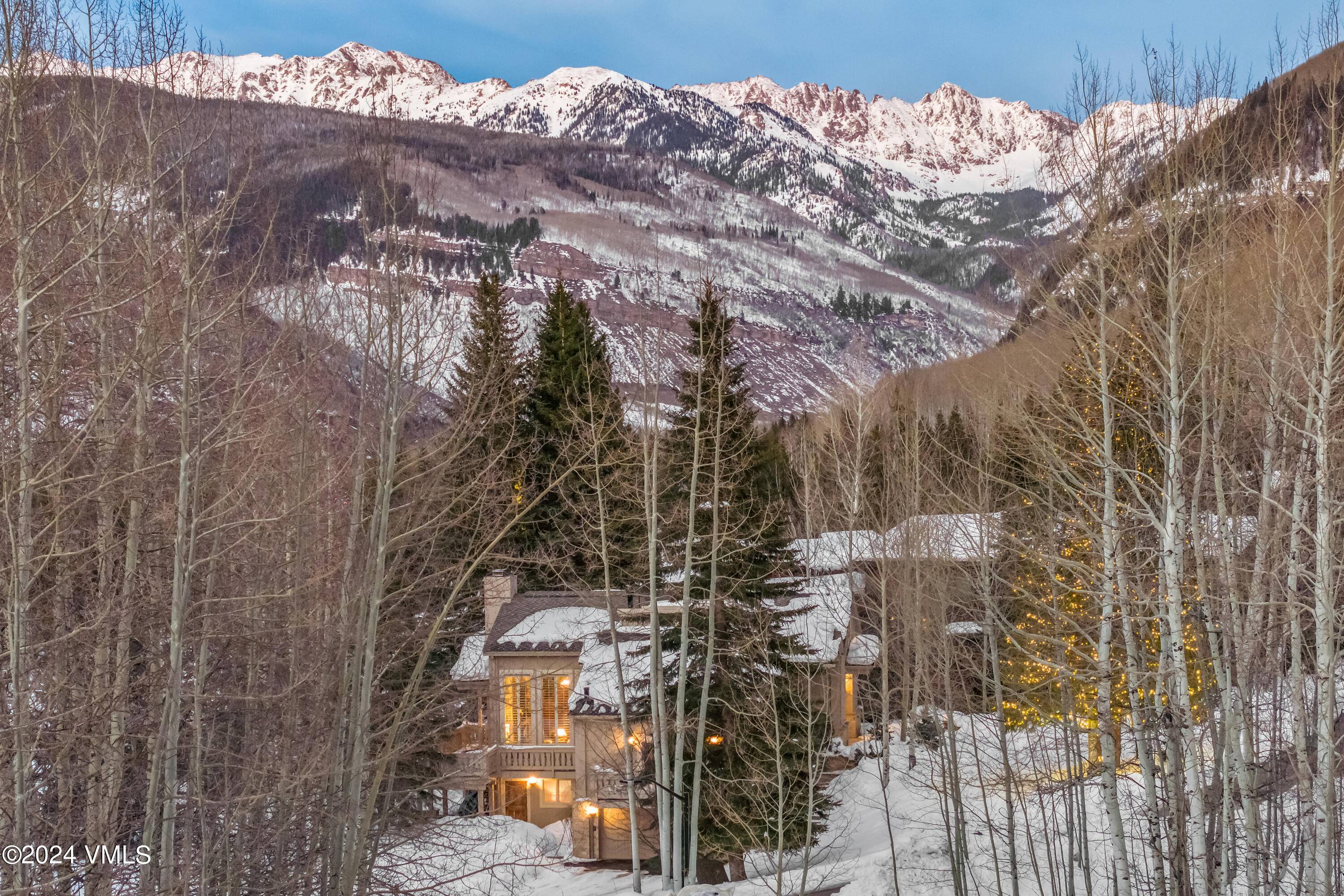 Nestled alongside the picturesque 4th green of the renowned Vail Golf Course, and just a half mile from the Golden Peak base area of Vail Mountain, this home offers unparalleled ...