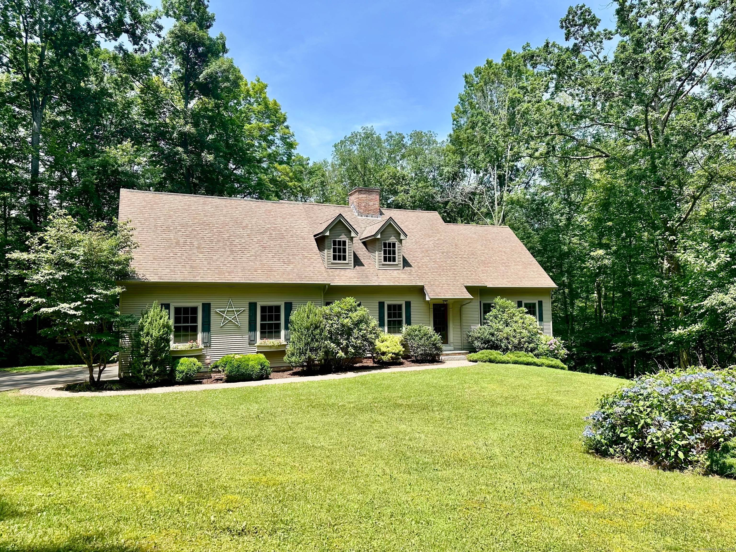 Discover the perfect blend of elegance and convenience in this custom Cape Cod home, nestled privately in Chester, CT.