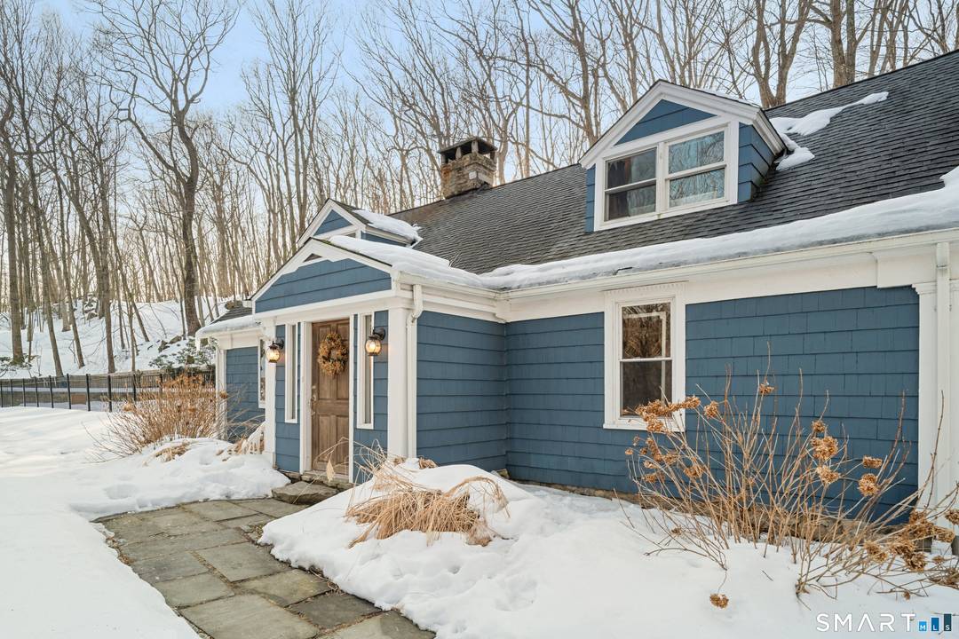 A rare and beautifully updated New England Cape offering timeless character and a private backyard retreat with heated in ground pool, newly designed patio and outdoor fireplace.