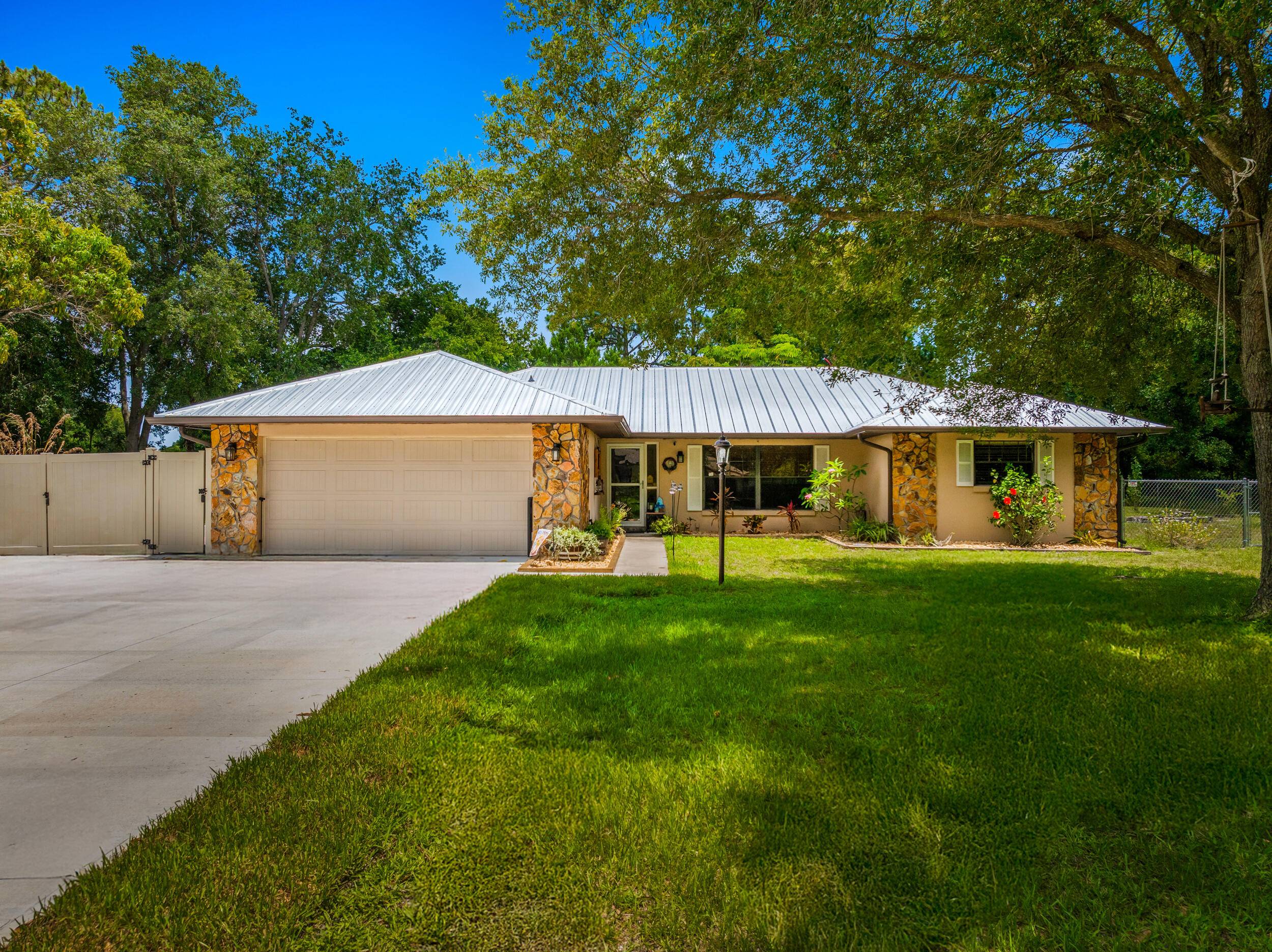 Discover this charming home in Lakewood Park, nestled on two lots equaling.