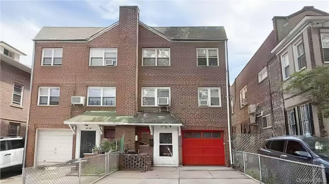 Welcome to this beautiful solid brick legal 2 family home perfectly situated in the heart of Elmhurst !