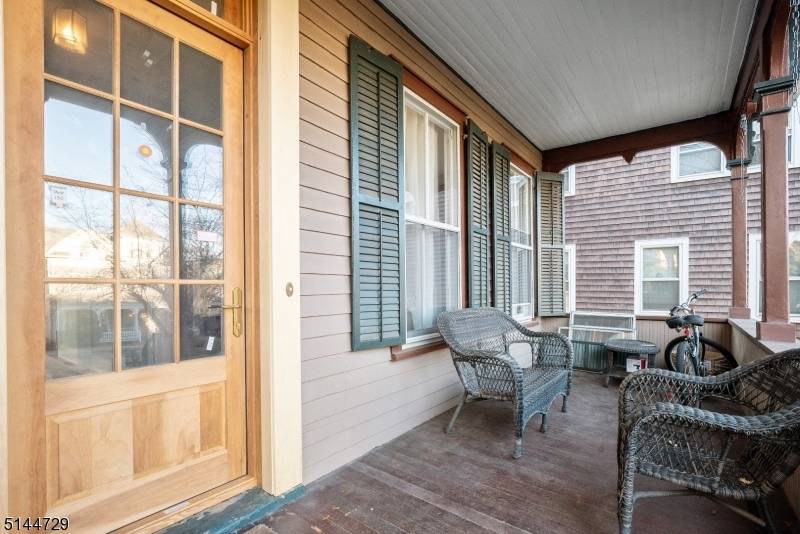 Classic In Town Victorian with 3 finished floors of living, fenced yard, patio and a spectacular front porch !