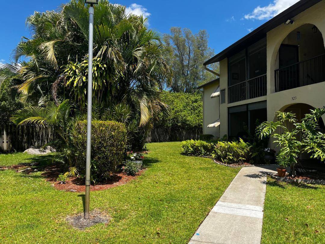 Welcome to your new corner unit oasis in the heart of 33463 !