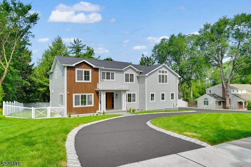 Welcome to this stunning 6 Bedroom, 5 full and 2 half Bathroom, NEW CONSTRUCTION Center Hall Colonial Home with Circular Driveway situated on a sprawling.