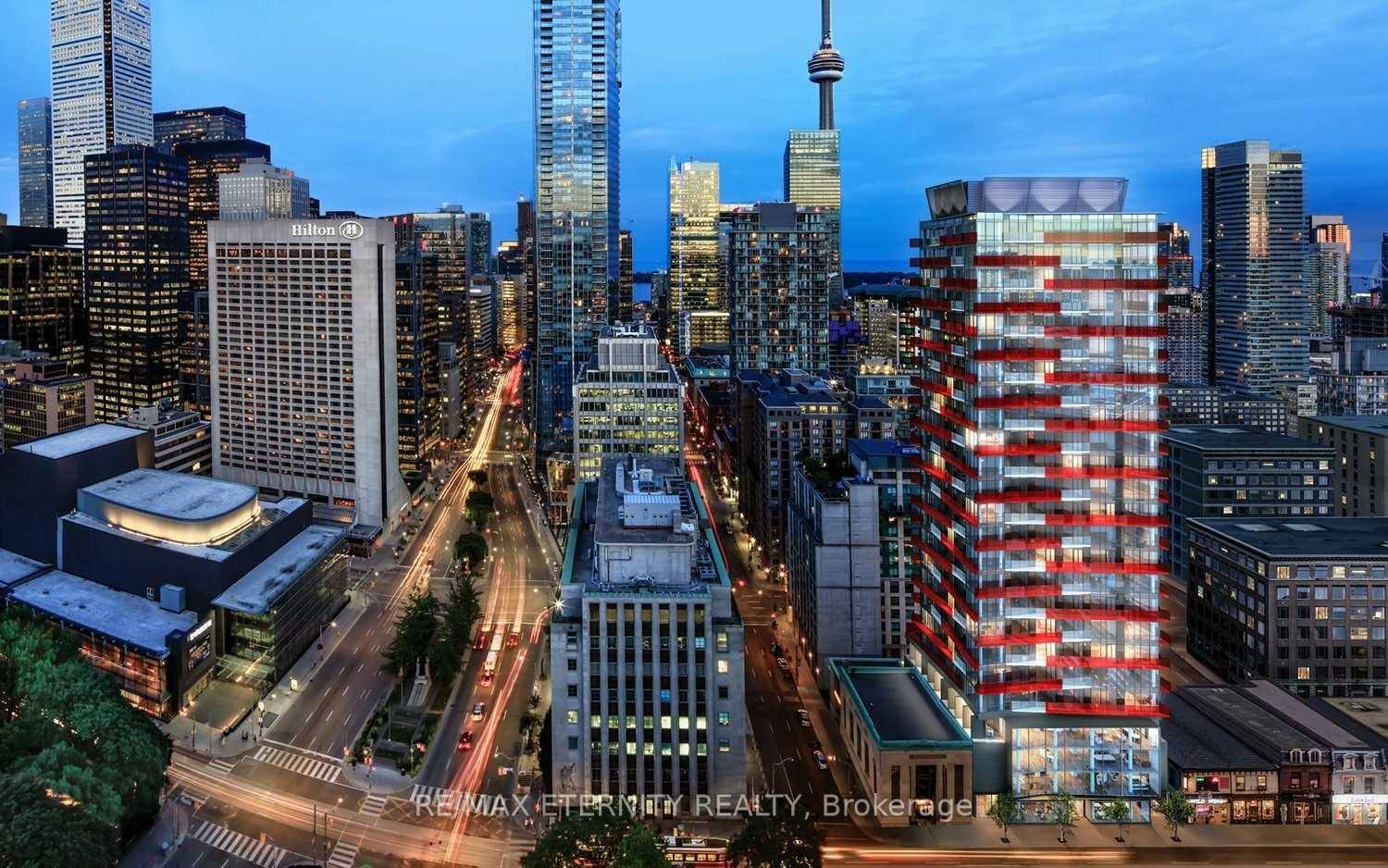 Modern 1 bedroom unit featuring an open concept layout with floor to ceiling windows and stylish laminate flooring throughout.