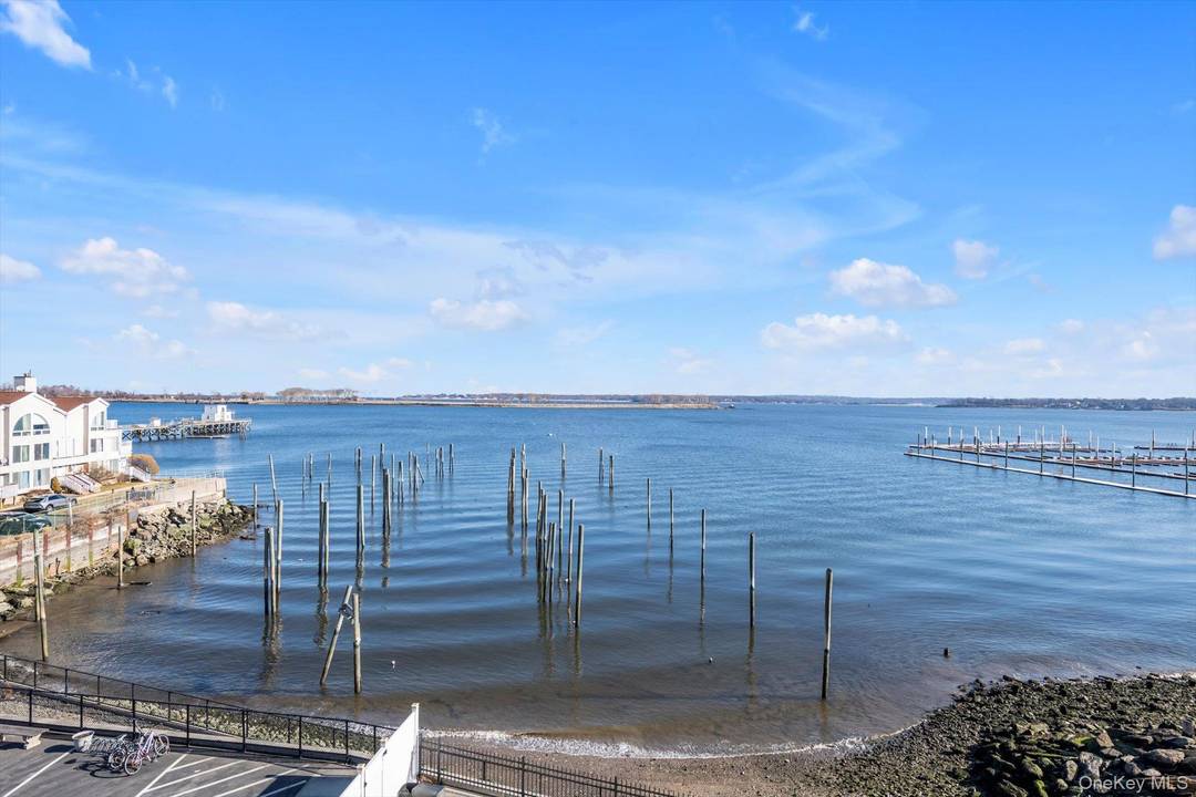 Direct Waterfront Views Corner Unit amp ; Top 3rd Floor Apartment in the Exclusive amp ; Gated Sailmaker Condominium Building in the Heart of City Island !