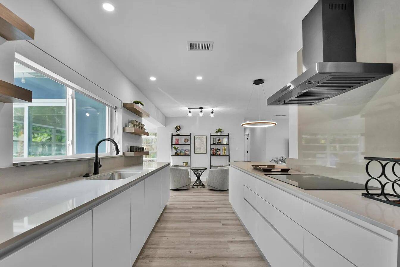 Welcome to this beautifully remodeled 4 bedroom, 2 bathroom single family home that perfectly blends comfort, convenience, and value.