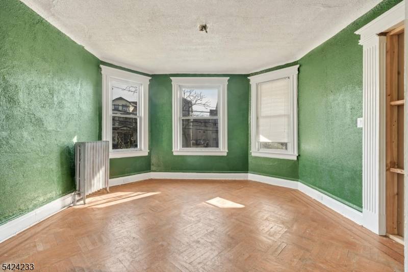 Two family home offering 6 bedrooms and 2 full baths in a convenient Newark location.