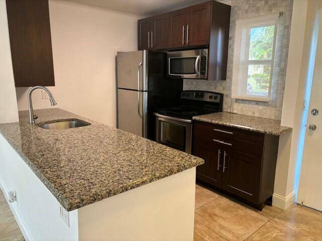 First floor 2 bedroom 2 bath unit with updated kitchen with granite countertops.