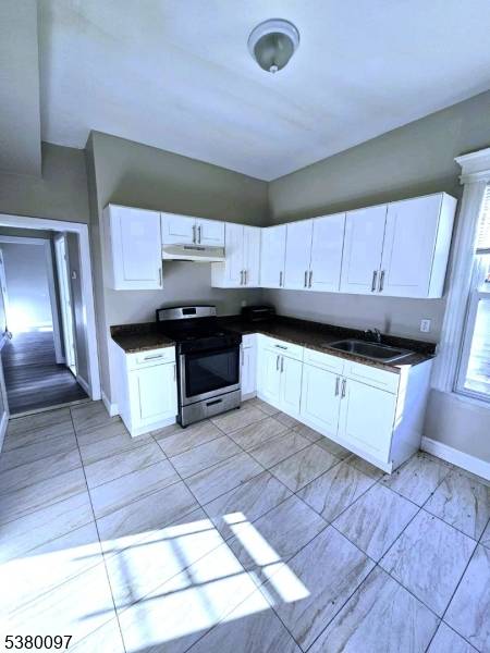 Welcome to 73 Seymour Ave, a beautifully renovated three family home located in a charming neighborhood of Newark, NJ.