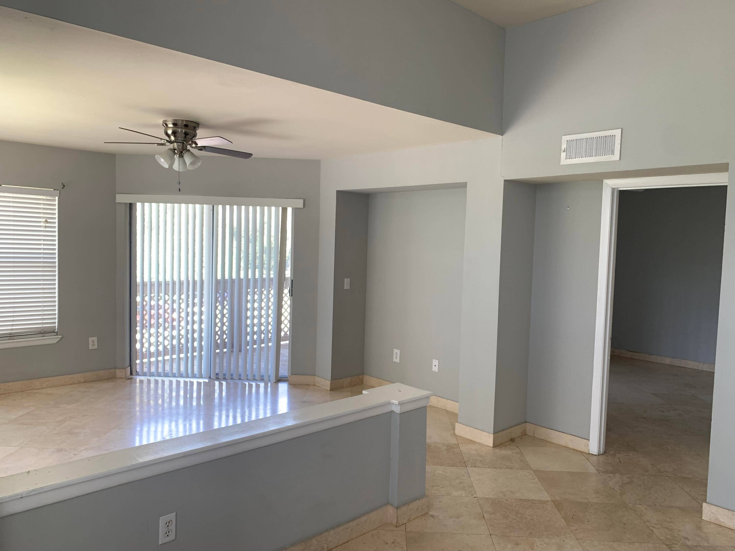 BEAUTIFUL MARBLE FLOORS THROUGHOUT THE ENTIRE UNIT, HIGH VOLUME CEILINGS, OPEN AIRY.