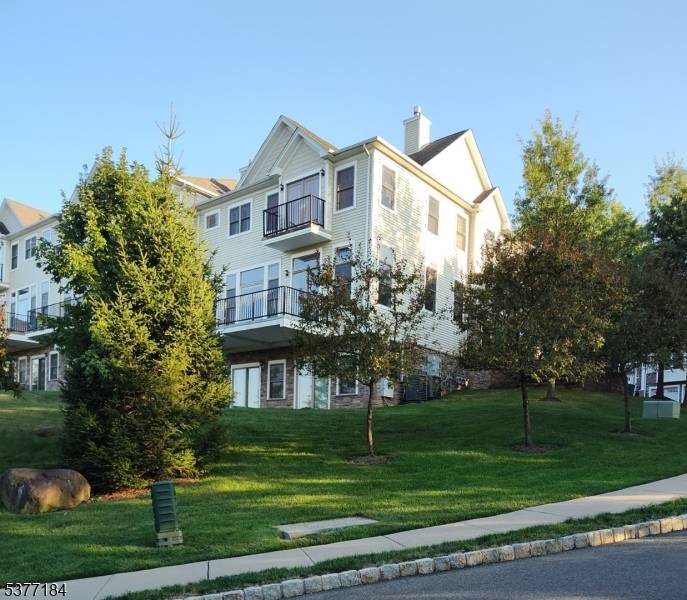 Exquisite ultra luxurious custom end unit town home in highly coveted Hidden Ridge of North Caldwell.