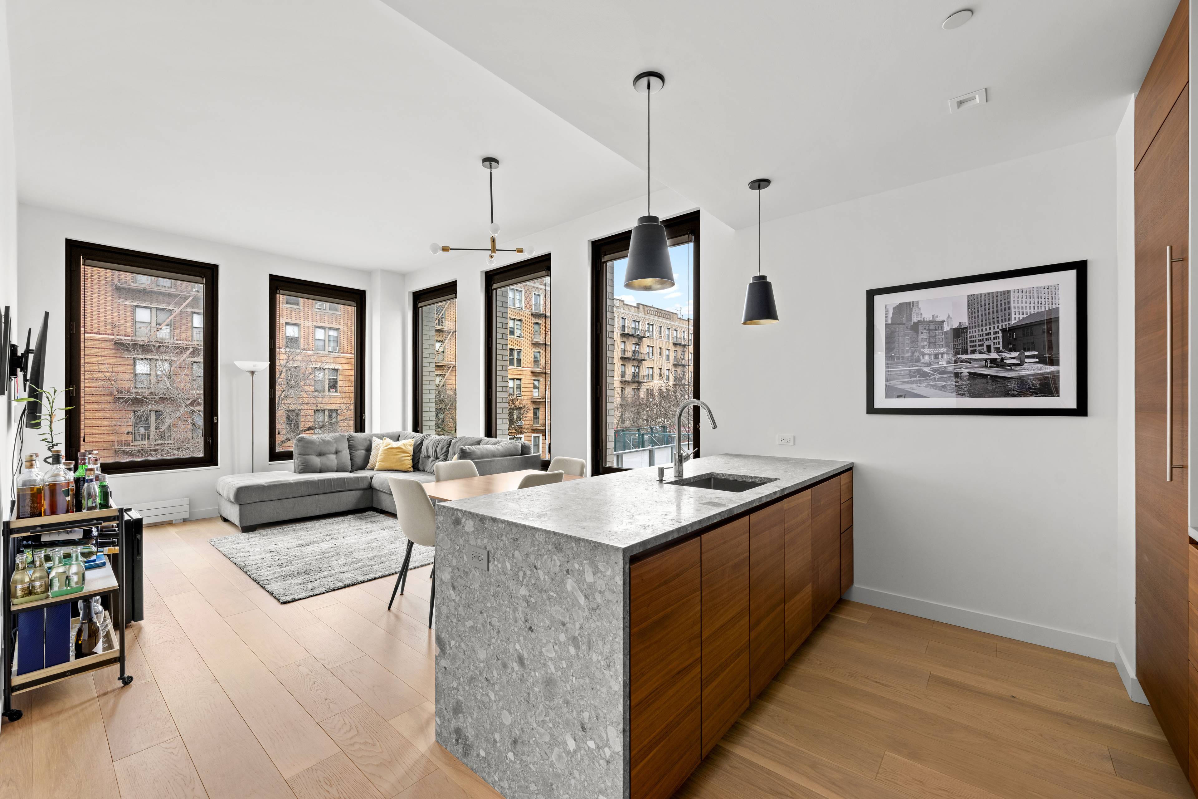 Welcome to this beautifully appointed one bedroom, one bath corner residence at The Rowan.