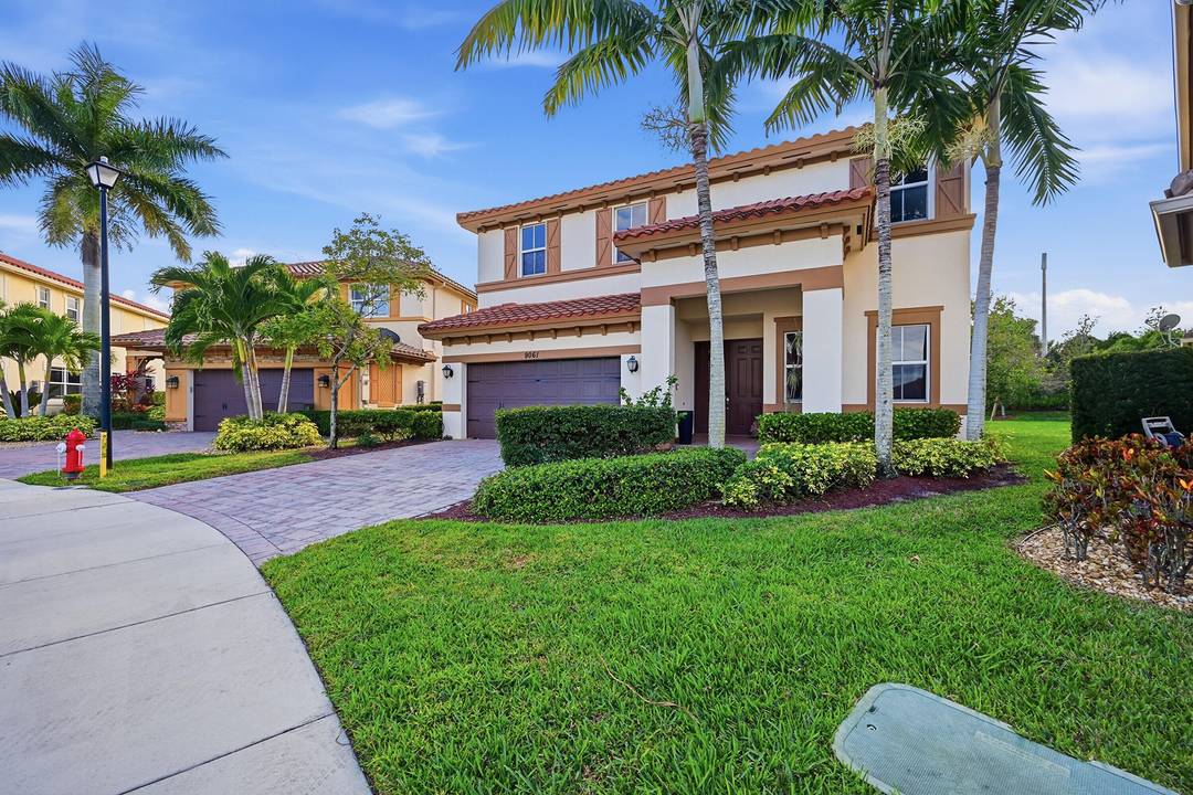 Over 4100 square foot 5 bedroom, 4 bath two story home with a 2 car garage in the prestigious gated community Miralago of Parkland.