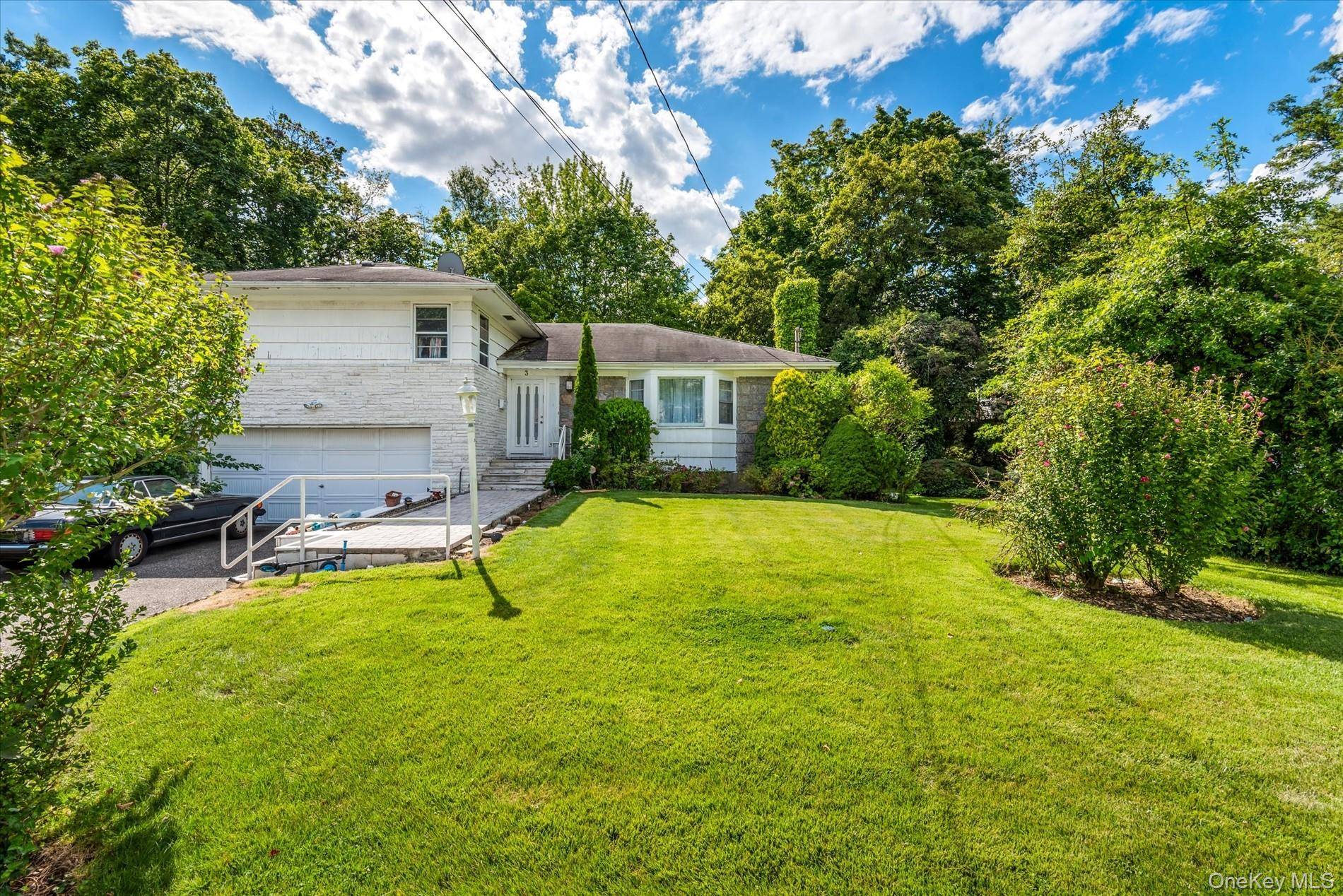 Welcome to this sun drenched and inviting home, perfectly situated mid block on a desirable and tranquil street in the Village of Great Neck.